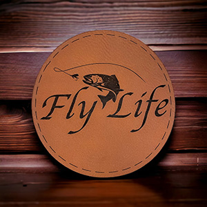 Image of a leather patch with a bass fish and fly life text